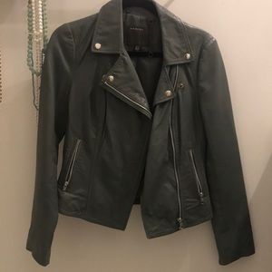 Motorcycle style jacket. Unsure of the actual material. soft grey color.